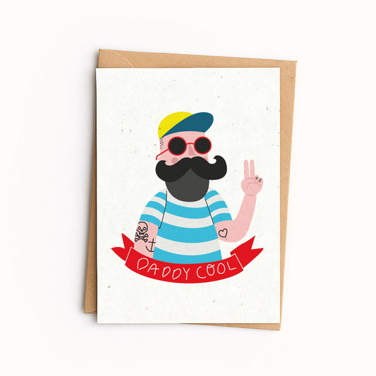 Greeting card with a stylized illustration of a person wearing sunglasses, a cap, and a striped shirt, with 'Daddy Cool' text on a white background.