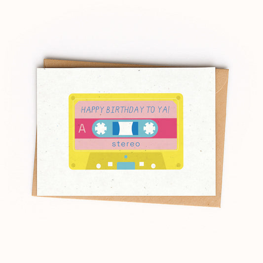 Cassette tape-shaped birthday card with a colorful design on a white background. Cassette reads ' Happy Birthday to Ya'.