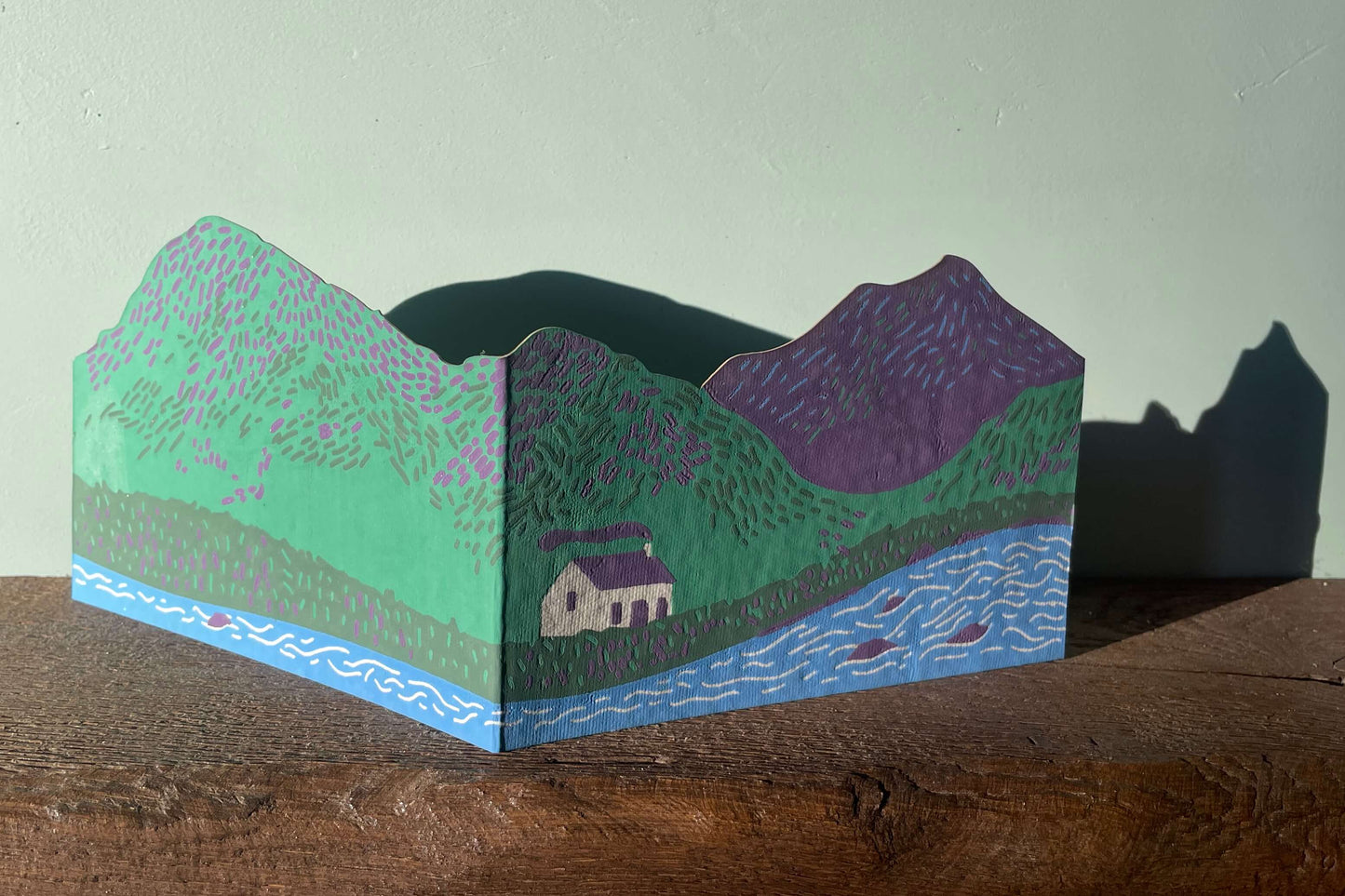 Scottish bothy and hills greeting card with a plain background